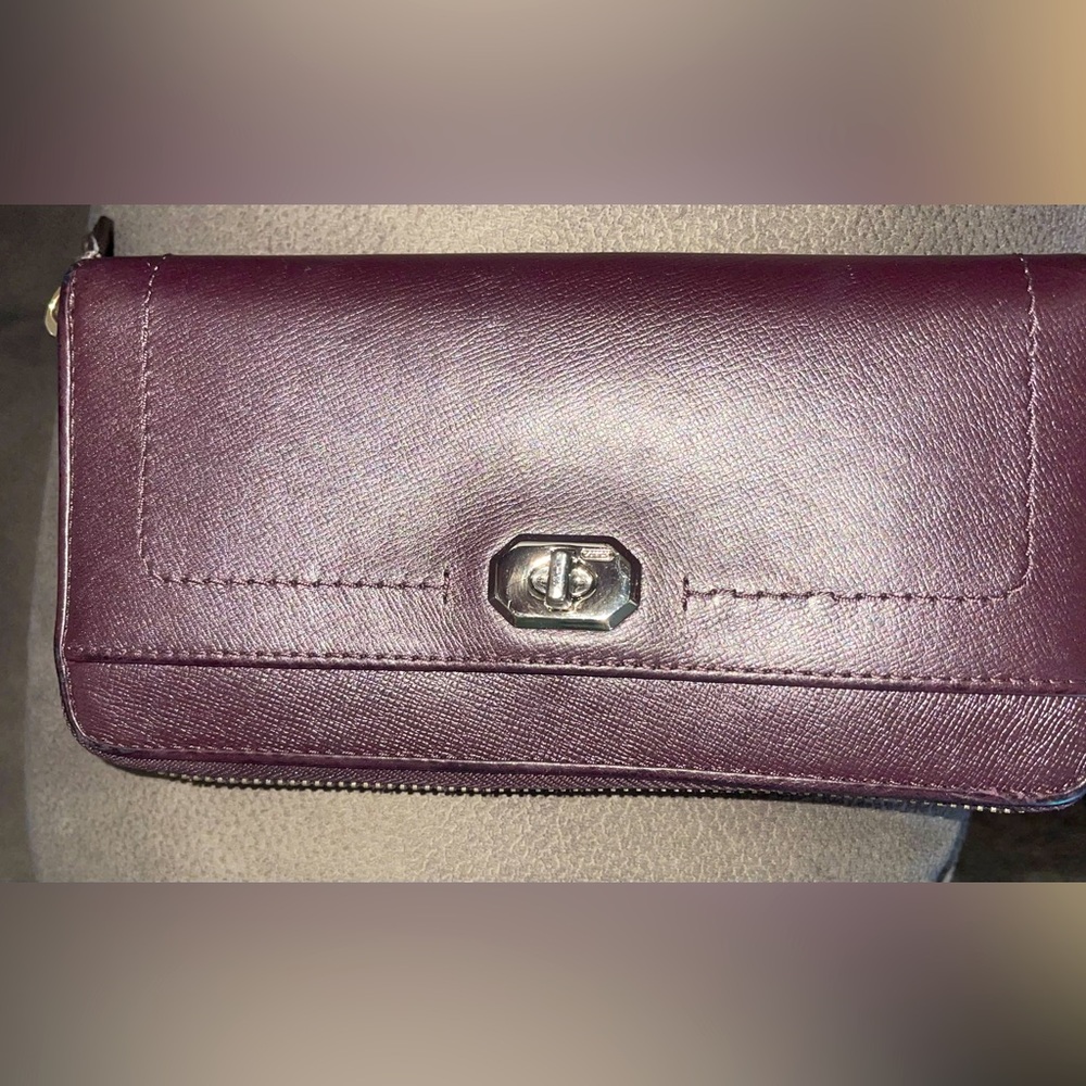 Large Coach vintage burgundy zip wallet. See pictures for minor wear inside
